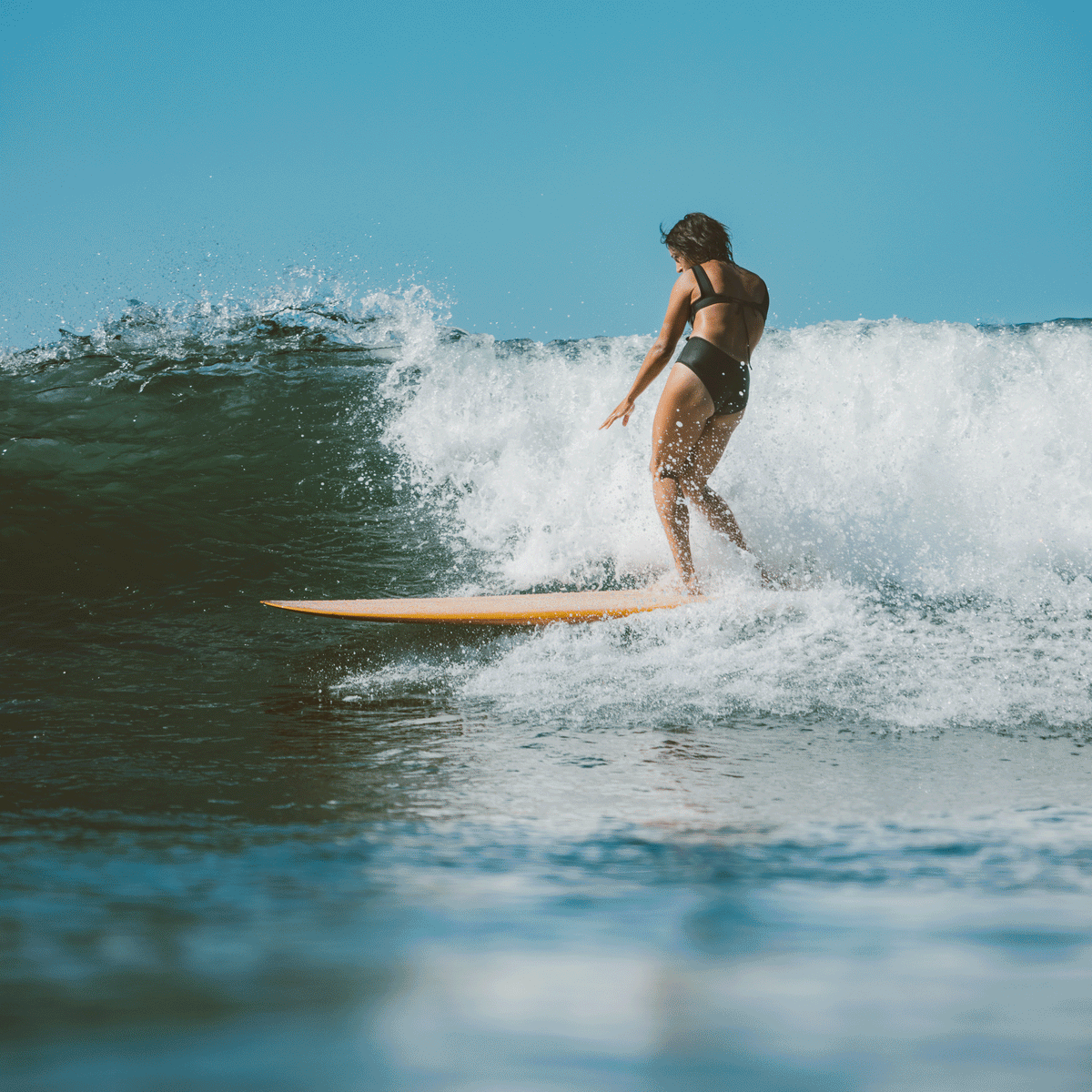 The Best Surfing Swimsuits and Surf Bikinis That'll Stand Up